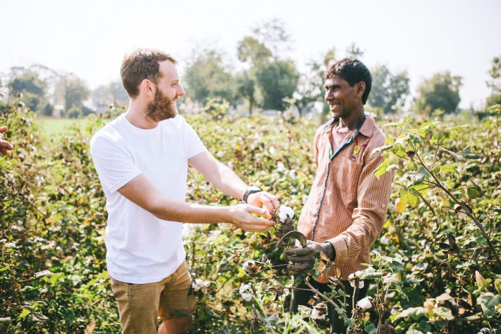 men in organic cotton field in India