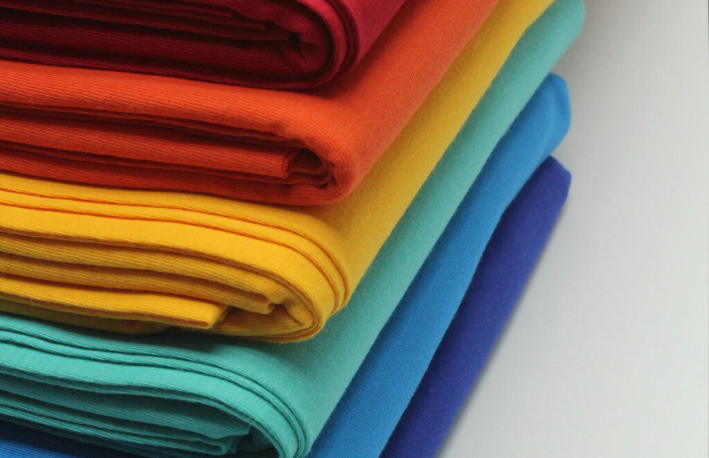 stack of colorful fabrics