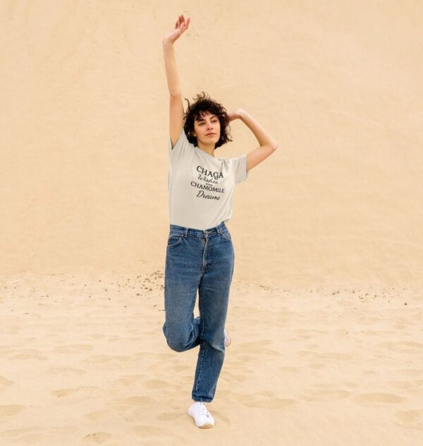 woman wearing the Chaga Wishes and Chamomile Dreams organic cotton classic tee in oat color