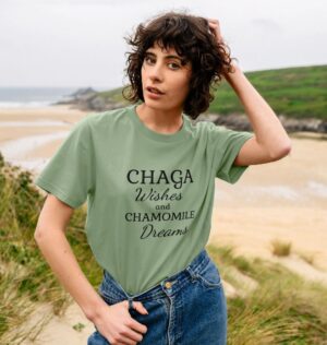 woman wearing the Chaga Wishes and Chamomile Dreams organic cotton classic tee in sage green color