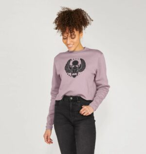 woman wearing the Winged Scarab boxy sweatshirt in mauve