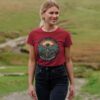 woman wearing "Roots to Riches" crew neck tee in cherry color