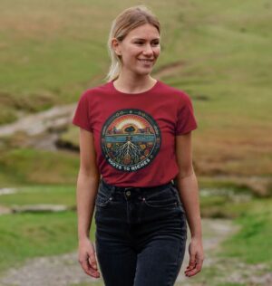 woman wearing "Roots to Riches" crew neck tee in cherry color