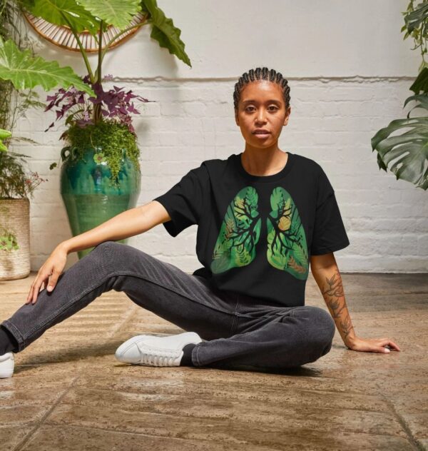 woman wearing the "Earth Lungs" organic cotton boxy tee in black