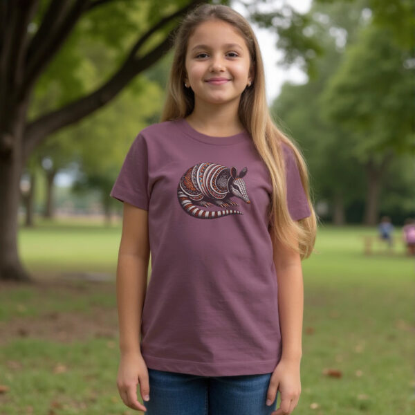 girl wearing the Banded Armadillo organic cotton t-shirt in eggplant color