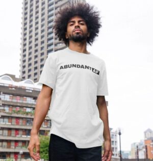 man wearing 'Abundant AF' t-shirt in white color