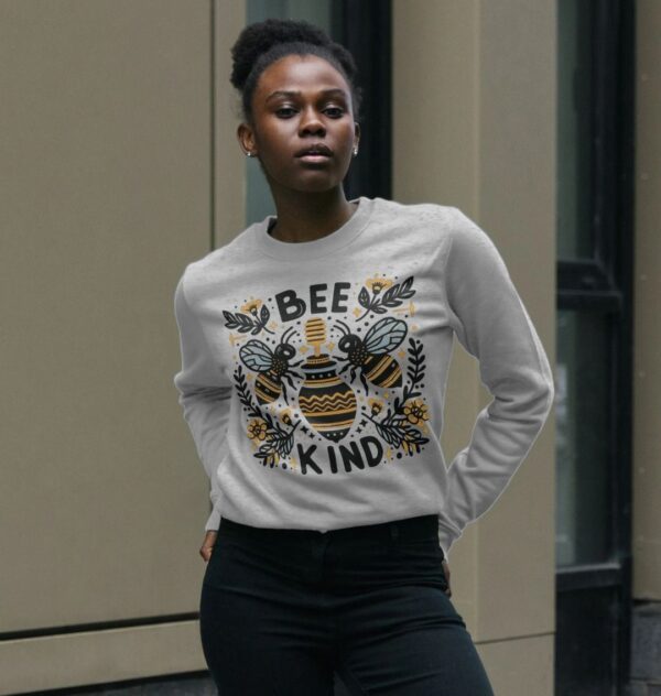 woman wearing the "Bee Kind" Remill swewatshirt in grey