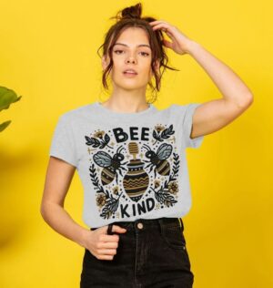 woman wearing a remilled organic cotton tee with Bee Kind graphic