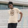 man wearing organic cotton "In Crust We Trust" t-shirt in oat color