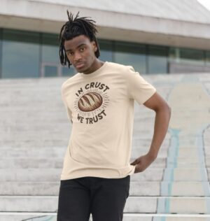 man wearing organic cotton "In Crust We Trust" t-shirt in oat color