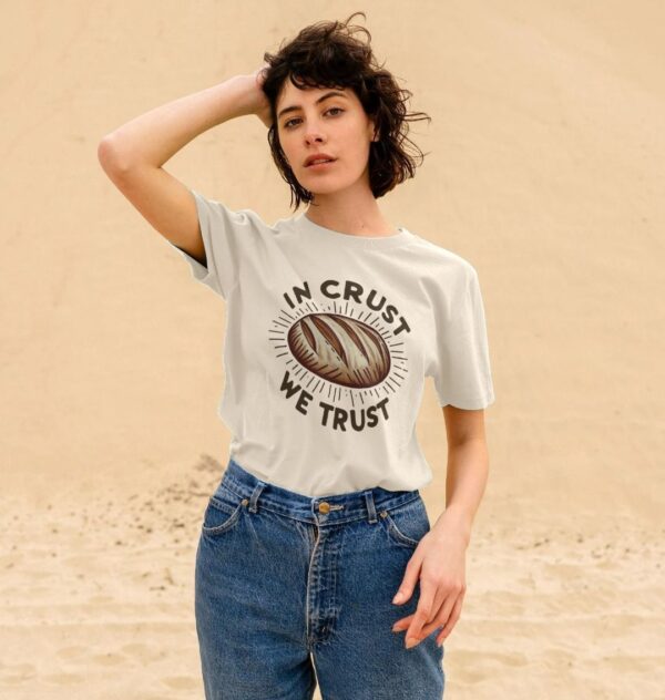 woman wearing "In Crust We Trust" classic organic cotton tee in oat