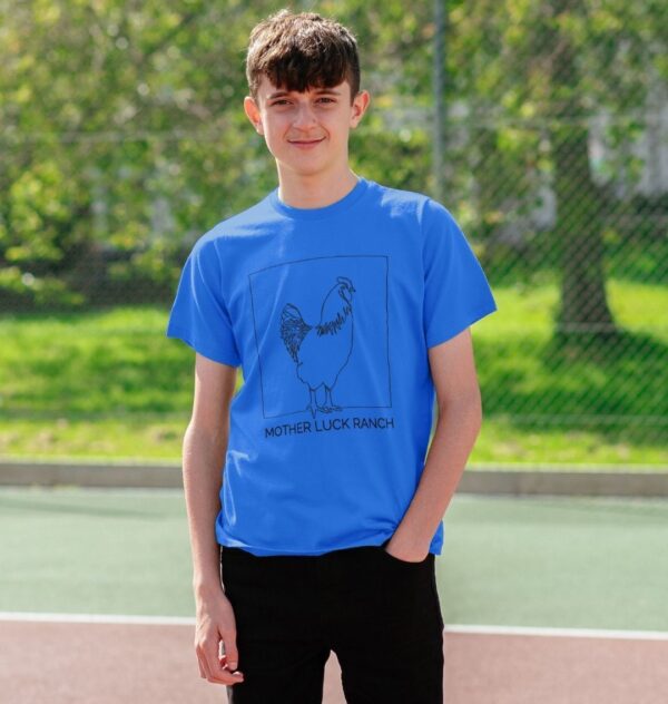 boy wearing the Egg-cellent t-shirt in bright blue