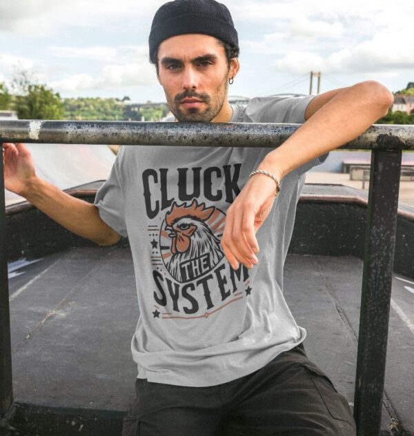 Man in skate park wearing the Men's "Cluck The System" Organic Cotton T-Shirt in Athletic Grey