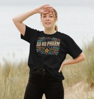 woman by beach wearing the Do No Pharm Organic Cotton Women's Boxy Tee in Black