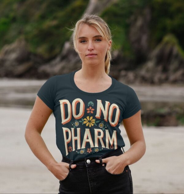 woman on beach wearing the "Do No Pharm" scoop neck tee in denim blue color