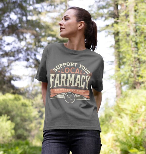 woman in woods wearing the Women's Support Your Local Farmacy Organic Cotton Relaxed Tee in Slate Grey