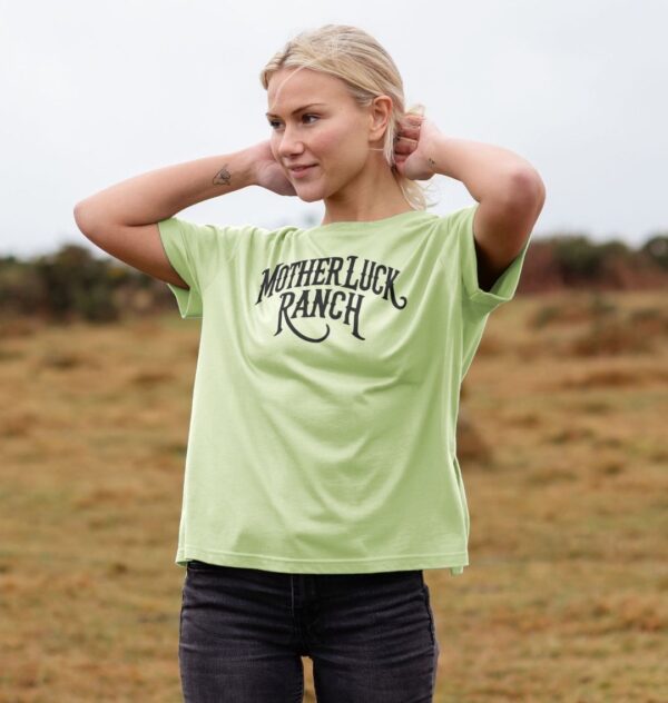 Woman wearing the Organic Cotton Old West MLR Logo Relaxed Tee in Pastel Green