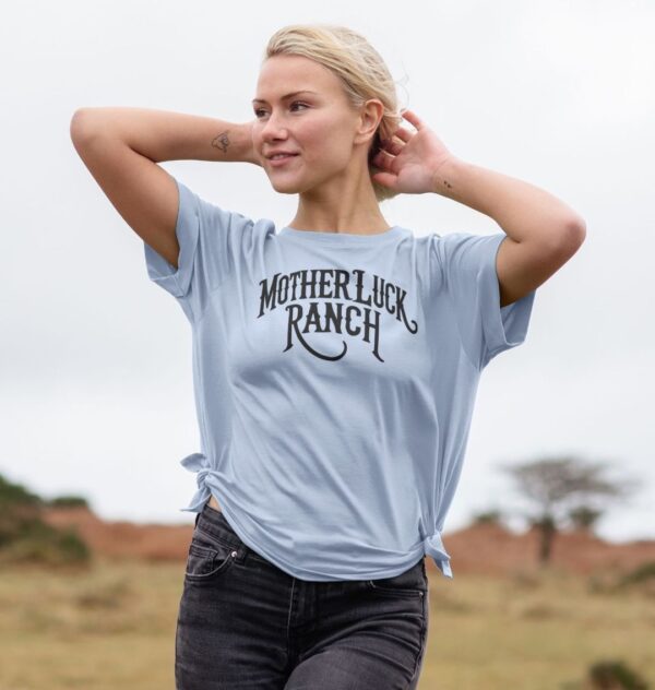 Woman wearing the Organic Cotton Old West MLR Logo Relaxed Tee in Sky Blue