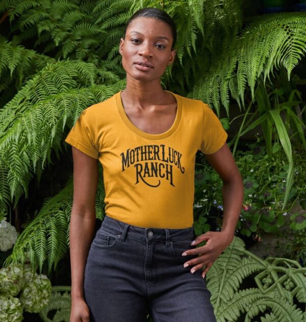 Woman wearing the Organic Cotton Old West MLR Scoop Neck Tee in Mustard