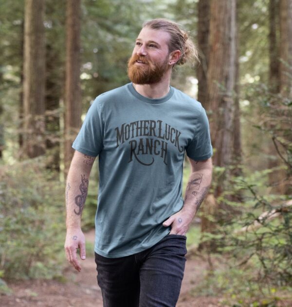 Man wearing the Old West MLR Organic Cotton T-Shirt in Stone Blue