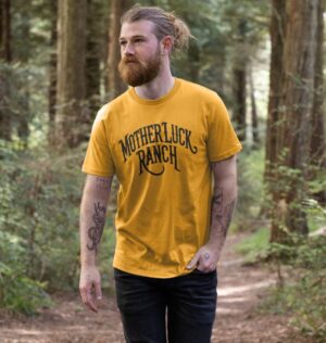 Man wearing the Old West MLR Organic Cotton T-Shirt in Mustard