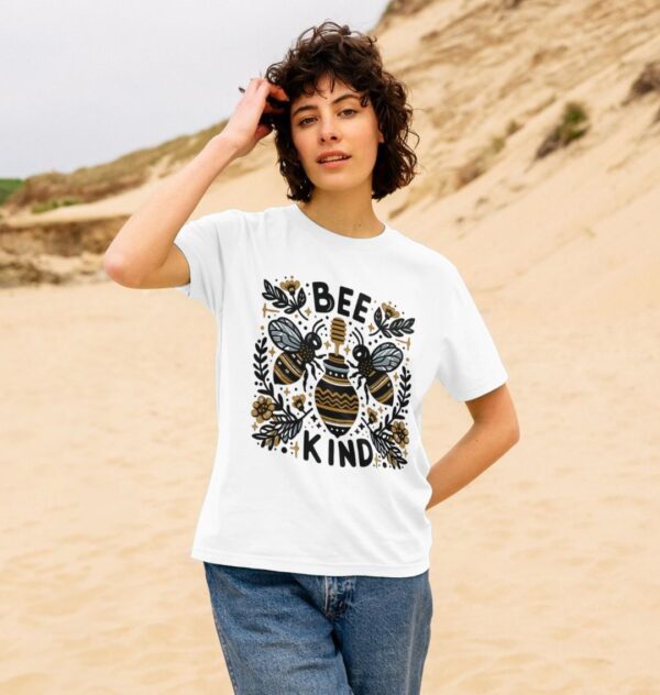 woman on beach wearing the Bee Kind Organic Cotton Women's Classic Tee in White