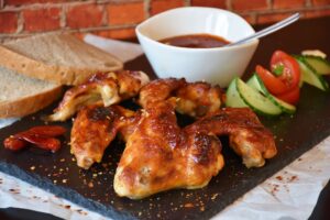 chicken thigh dinner with tomato and avocado