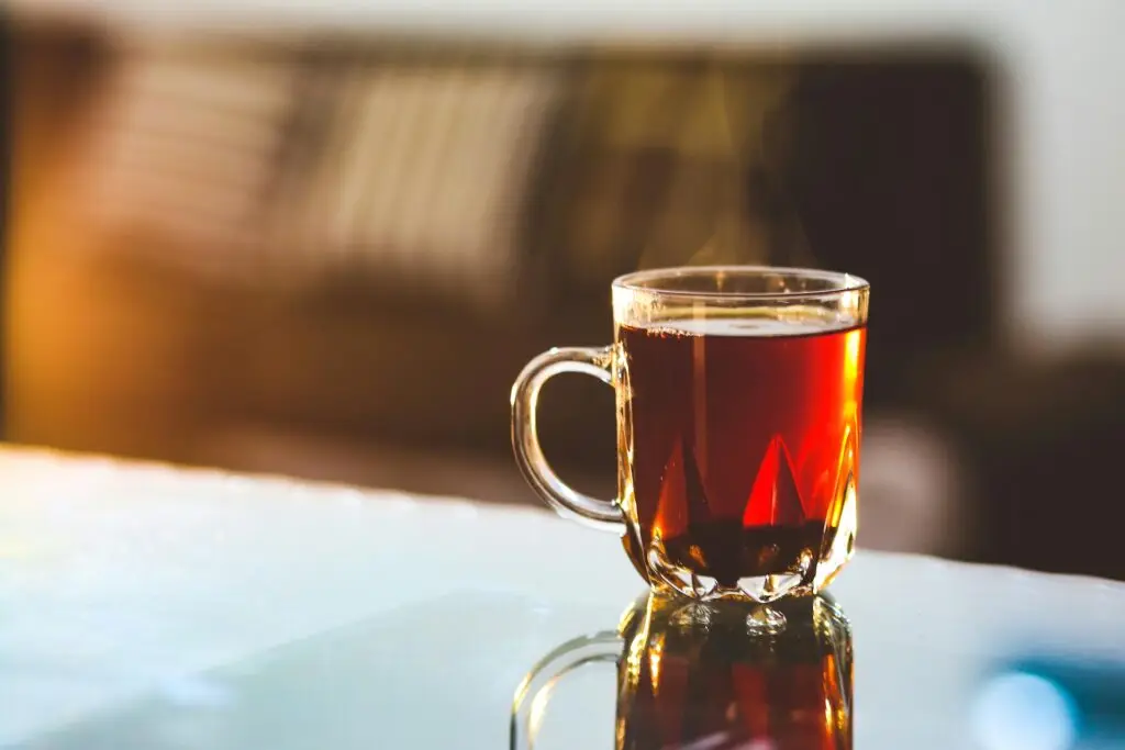 cup of tea in a glass teacup on a table