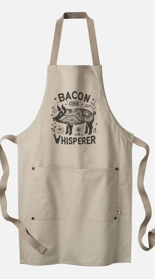 organic cotton apron with Bacon Whisperer text and folk art inspired design